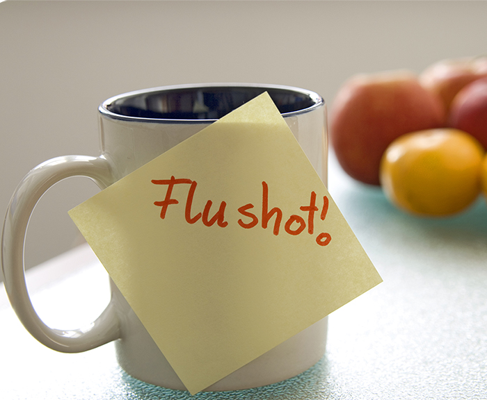 mug with flu shot sticky note